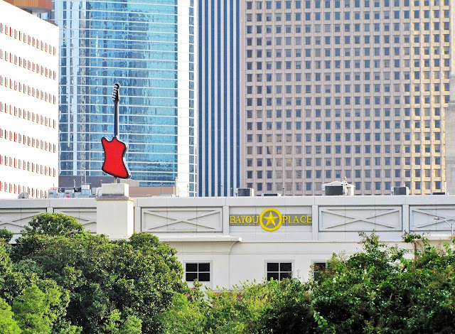 BAYOU PLACE WITH RED GUITAR 