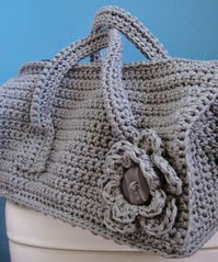 http://www.ravelry.com/patterns/library/crochet-duffel-purse