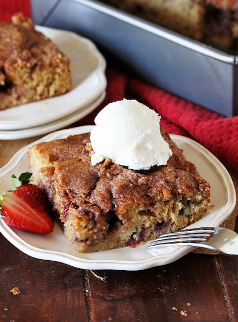 Piece of Old-Fashioned Strawberry Rhubarb Cake Topped with Vanilla Ice Cream Image