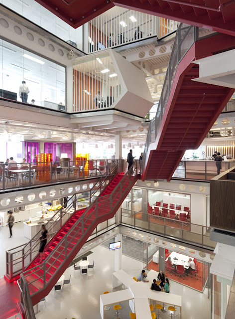 Photo of red staircase going up through several floors