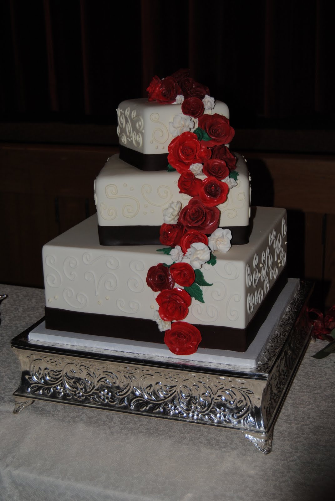 traditional wedding cake with flowers  and made red/burgundy sugar flowers. I love my new square cake stand