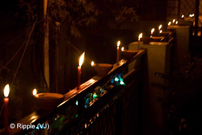 Posted by Ripple (VJ) : Diwali Celebrations 2008 (Indian Festivals of Lights): A row of Candles and Clay Diyas on Diwali Day: From opposite Side