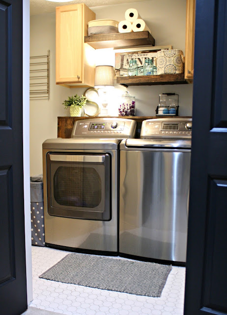 Basement laundry room with shelves for storage
