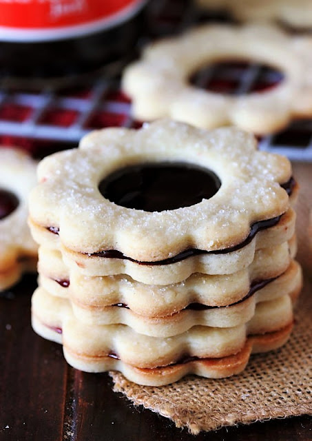 Raspberry Jam Sandwich Cookies Sprinkled with Sugar Image