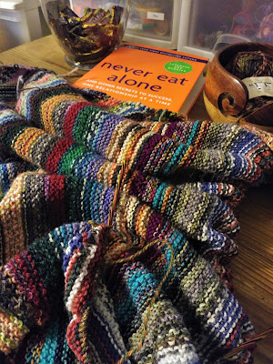 knitting a garter stitch blanket while reading Never Eat Alone by Keith Ferrazzi