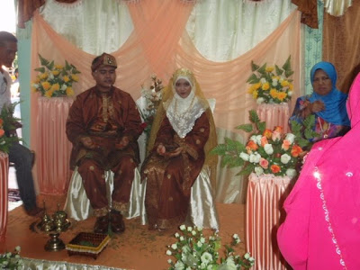 The bride and groom on the wedding dais