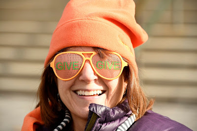 Angela Bevacqua, Senior Communications Specialist, wears give glasses and an orange hat to celebrate Colorado Gives Day 2016