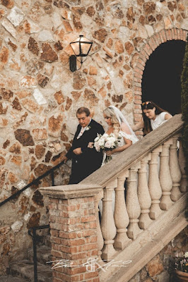 dad escorting bride down stairs for wedding ceremony