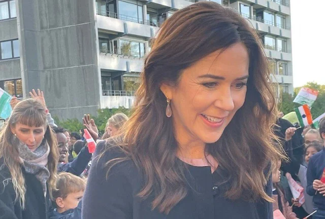 Crown Princess Mary wore a Hampton navy wool crepe coat by Goat, Jane Atelier and banora pleat neck silk blouse by Hugo Boss