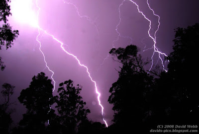 lightning strike - thunder storm at night with lightning striking and purple sky