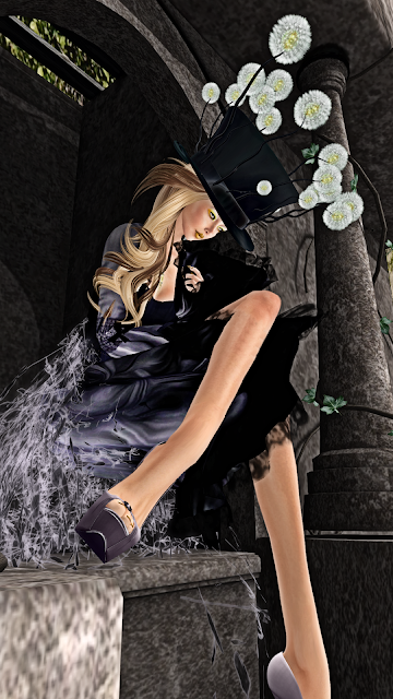sitting at an entrance to a crypt  in Second Life with a sad expression, wearing the title couture dress
