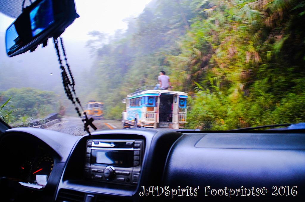 Traversing the zigzag and narrow road to Batad with 2 jeepneys ahead of us
