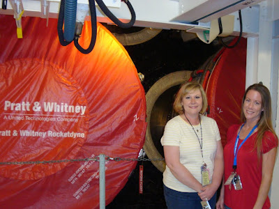 Leslie and I standing aft of Atlantis in the OPF