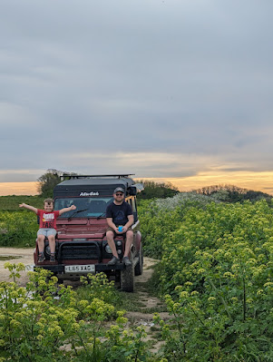 Sitting on the bonnet of a Defender