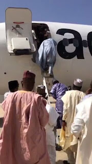 Aero passengers disembarking aircraft with ladder