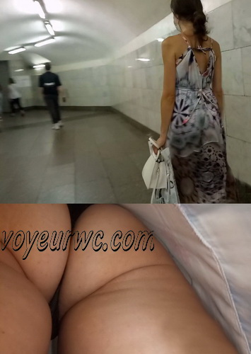 Upskirts 4843-4852 (Looking up a nice woman's skirt as she is walking up an escalator)