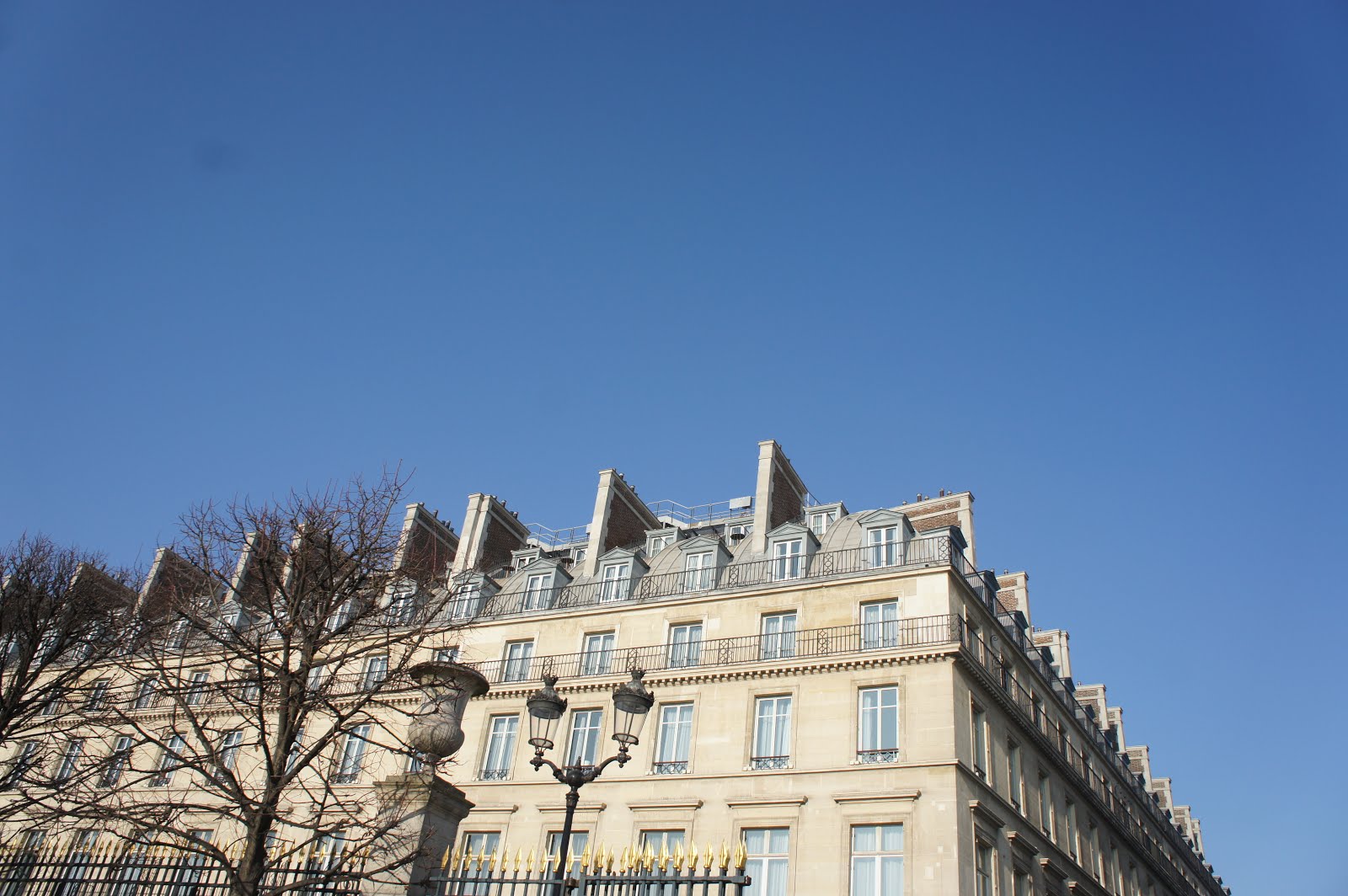 Haussman building in Paris, zinc roofs, Paris buildings near Place Vendôme, appartement Haussmanien