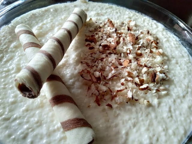 Kheer topped with almonds and wafers