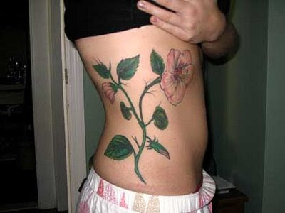 sexy side tattoos. flower rib tattoo sexy women.