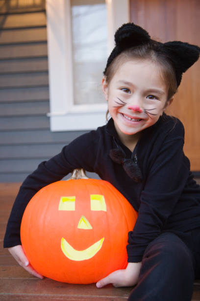 little girl with cat face painting