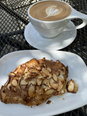 cappucino and almond croissant at Cafenated Coffee House in Berkeley, California