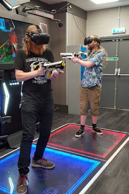 my partner and 19 year old son playing two person shooter VR gaming at X-Gen VR Stockport