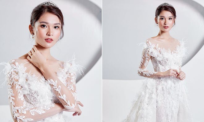 Á hậu Thùy Dung mặc váy cưới đính lông vũ, hóa 'thiên nga trắng' khi làm vedette sàn diễn