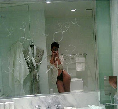 Leaked scandal pictures shows resembling Rihanna in front of a mirror 