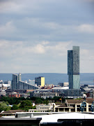 . on the iconic Hilton Hotel building and nearby Old Trafford stadium. (sam )