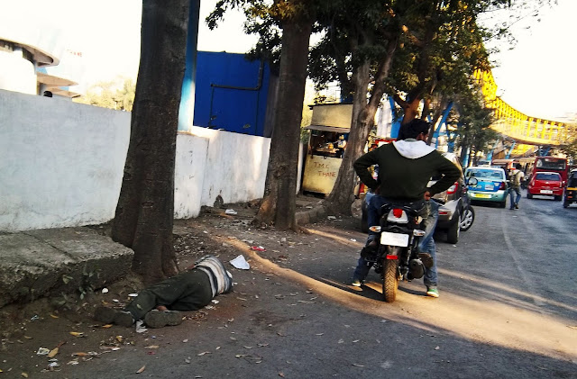 drunk man passed out on side of dusty road