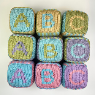 hand knit abc 123 foam blocks in pastel green, blue, purple, pink and yellow