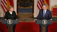 President George W. Bush and German Chancellor Angela Merkel react to a reporter’s question during a joint news conference at the White House, Thursday, Jan. 4, 2006, where they answered questions on Iraq, the Middle East and U.S.-European economic issues. White House photo by Paul Morse.