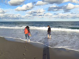 Dipping your feet in the ocean in Delray Beach, Florida, USA