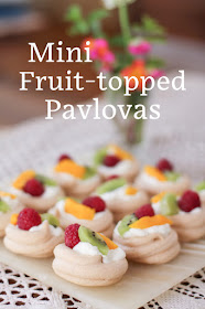 Food Lust People Love: These mini fruit-topped pavlovas are the perfect dessert for a dinner party or potluck.  The meringue bases can be made ahead of time then all you need to do is whip the cream and pop the fruit on top. No matter how it got there, pavlova is still a quintessential Australian or New Zealand dessert. A traditional fruit topping down under is passion fruit pulp but you can use whatever fruit you have on hand. Serve the mini fruit-topped pavlovas shortly after topping them as the cream will soften the meringues.