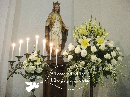 A closer look at the flower arrangements in front of the main altar