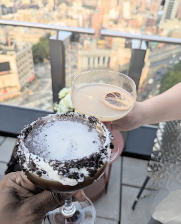 Enjoying Cocktails with a Rooftop View