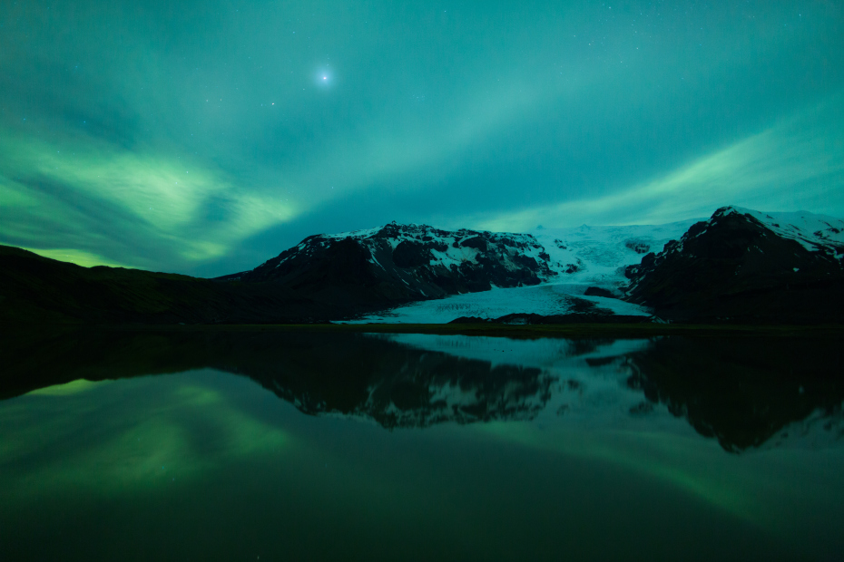 The northern lights (Aurora Borealis) above a glacier is a common sign in Iceland. -  10 Incredible Images That Will Make You Want To Pack Your Bags And Move to Iceland.