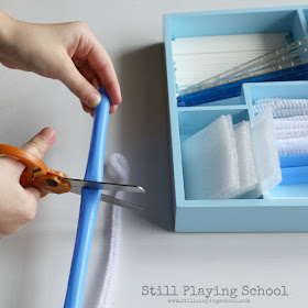Kids can work on cutting practice with a winter inspired tinker tray!