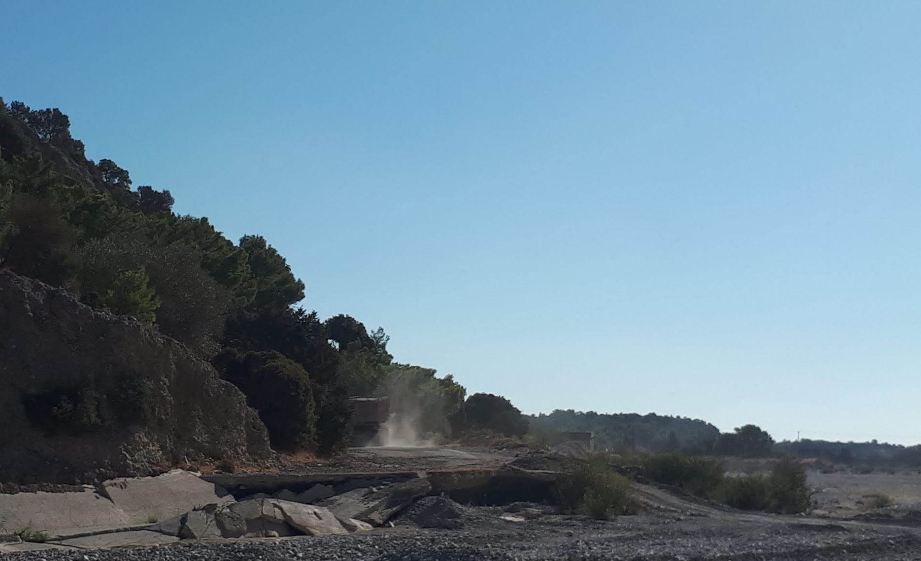 The large truck heading out of the river valley