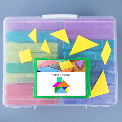 Photo of task card and tangrams on top of large bin of task card containers.