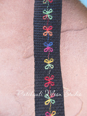 Closeup of decorative stitched webbing strap