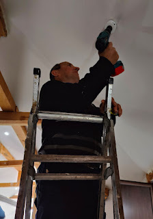 Bekir cuts a hole for the light fitting