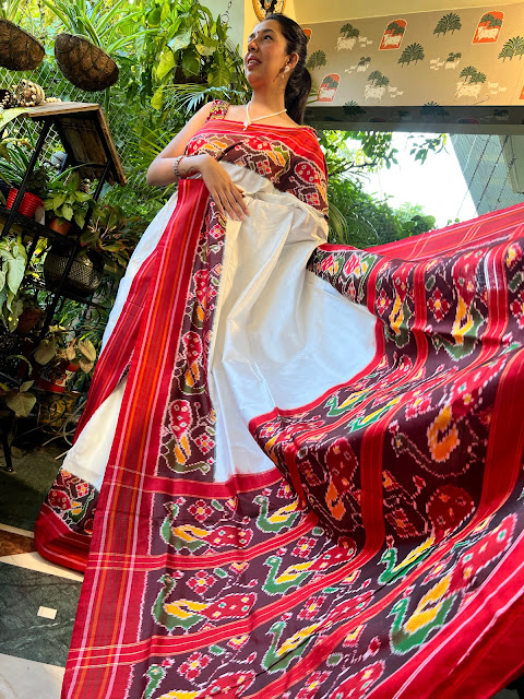 Cream & red pochampally saree with peacock motifs