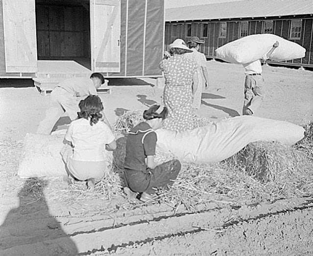 Internees in Arizona making mattresses with straw on 21 May 1942 worldwartwo.filminspector.com