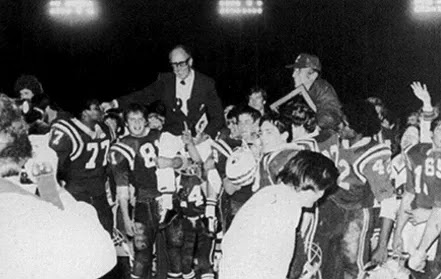 After defeating Wilson at Veteran's Memorial Stadium (1979) On the left (#77) Bob D., (#81) Adam P., Me (#24) in the middle doing all the work lifting Coach Ford, (#22) David D., (#42) Zachary B.