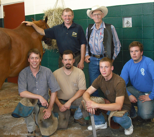 Buster Conklin posed with farrier instructor Michael Wildenstein and horseshoering school students at Cornell University vet school.