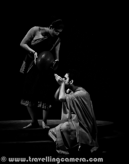 Chandalika was another very famous play of 14th Bharat Rang Mahotsav and it was not very easy to get tickets for the play. This play was performed twice during the festival - Once in Bengali and second time in Hindi. Here is a quick Photo Journey from Chandalika by Usha Ganguli...Tagore’s Chandalika tells the tale of Prakriti, an untouchable girl forced to live on the periphery of society as ‘chandalika’. No one want to play with her, people keep distance from her but at times increase closeness for their selfish reasons. Chandilika by Tagore is based on a story from a Buddhist text... and here I would like to highlight that 14th Bharat Rang Mahotsav 2012 is also a platform to celebrate Rabindarnath Tagore's 150th Birthday. Many of his plays are being shown during Bharangam 2012 !!!Play starts with some dialogs by Usha Ganguli where she describes the situation of her region without water and how people are crying for water. Usha is playing main role in this play. She has a daughter and both of them are treated badly by higher society. At the same time, she helps the local kingdom by helping in various problems like water scarcity.Here is a photograph of musicians in this play who were also sitting on the stage. There was no recorded music during this play and whole music direction was awesome. I liked the running horse sound the most. The man in the middle created that sound through the big drum in front of him. Girls on the other side sung a beautiful song and they also joined for acting, while one of the monk was moving around the villages to spread right information about caste system and related issues.Here is a photograph showing Prakriti with her mother and when she is requesting her mother for not going to King's place. Her Mother is invited by king to use her magical powers to bring water in the region and make people happy. During the dialog, Prakriti was confident that King will not allow lower cast people to have water and it will be accessible to other villages. So why not resolve it locally first and then do it for others.After a detailed conversation, Prakriti's mothr showed trust in King's words and started the magical process of bring water from ground. After some long process, she succeeds in bringing water to the region. As the sound of water reached to king's people, they alerted everyone and asked to leave the place as water will be distributed to Brahmans first and then other will get if there will b something left.After the news that lower caste people will die without water, even when her mother brought water to other folks around the upper caste villages. She thought of breaking the main equipment of her mother.Again a photograph when Prakriti is worried about her identity as Chandal and why people run out of their place. No one wants to meet them etc.A very happy moment showing mother's emotions towards her daughter. She dresses her with flowers and hug to make her feel better.Here is a scene when Bagel vendor comes inside the village and all ladies checking different colors & designs. At the same time Prakriti is standing alone in the darkness, on back side. The small girl noticed her standing alone and offered some bangles and her mother dragged her back to ensure that gril doesn;t touch Prakriti. One day a Buddhist monk, Ananda, passes by the house Chandalika and asks for water. When Prakriti tells him her caste, thinking he would move on, he dismisses her hesitation with the simple statement that God created everyone equal. During the play Prakriti denied to offer water many times by a thought that she will not be doing right thing by offering water to this Monk as he is pure person and she belongs to lower cast.After meeting the mon and knowing his thoughts, Prakriti recognized as a valid human presence for the first time in her life... At the same time, it was not easy for her to forget all incidents from past when she was declared as someone is society, who should not come near to anyone in Brahman Samaj or higher caste people. Above Photograph shows a lady protecting her daughter while Chandalika crossing by. This lady was selling bangels and this small girl wanted to offer some bangels to Prakriti...  Prakriti falls desperately in love with Ananda, the monk and pleads with her mother, a woman with extraordinary magical powers, to cast a spell on him so that he returns.Prakiriti's Mother is very famous in the region for her magical powers. Even people believe that she can do anything. In above Photograph queen is sad about the fact that her parrot left her and flew without any prior notice. She sent some men to bring Prakriti's Mother, who can bring the parrot back with her magical powers.The play follows this plot around Magical powers and develops events as they unfold. While presenting the manifold forms of love, including conflict and violence, and the manner in which deep emotion is capable of operating, Chandalika also allows a certain insight into the polarities of life in the 21st century.Above Photograph shows Prakriti and her mother indulged in practicing magical practices to have Ananda back in her life, although it was not that easy and her mother was well aware of it.Usha Ganguli doesn’t need an introduction. Based on a story from a Buddhist text, Tagore’s Chandalika 'bespeaks the anguish of a girl, Prakriti, who is ostracized by the society and lives on its edges. She does not understand the consequences of her birth into a family which is regarded as 'untouchable'. She watches wistfully from the shadows as the world passes her by as even her shadow was inauspicious to some extent. (Courtesy- Know More)In this particular play , Rabindranath hypothesized not only a warmth of love, but also created vengeance and violence. Cast of this plat includes - Usha Ganguli, Turna Daas, Mishka Haleem, Sangita Ghosh, kanchanmala Sengupta, Sunaina Naha, Pooja Rai, Dalita chakravarti, Artrika Ghosh, Surangana Gupta, Polomi Banergi, Kathakali Banik, Mausami Dutta, Babita Tiwari, Sohini Mukhargi, Sandhya Chakravarti, Swapn Moitra, Khrishnedu Chakravarty, Rajkumar Singh, Anand pandey, Balram Das, Raju Khan, Suraj Singh..Usha Ganguli, lead actor and director of Chandalika after completion of the play. This play is basically in Bengali and played in Hindi which is really commendable to present same play in two languagesOne of the NSD representative presenting flowers and 14th Bharangam Momento to Usha Ganguli at Kamani Auditorium after successful show of the play Chandalika.Whole cast of Chandalika play !!!