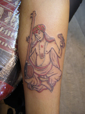 Here's a picture of the tattoo. Musically, Shashikiran
