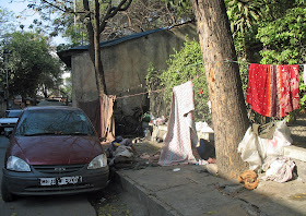 people sleeping on pavement