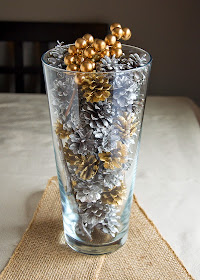 gold and silver Christmas centerpiece with pinecones